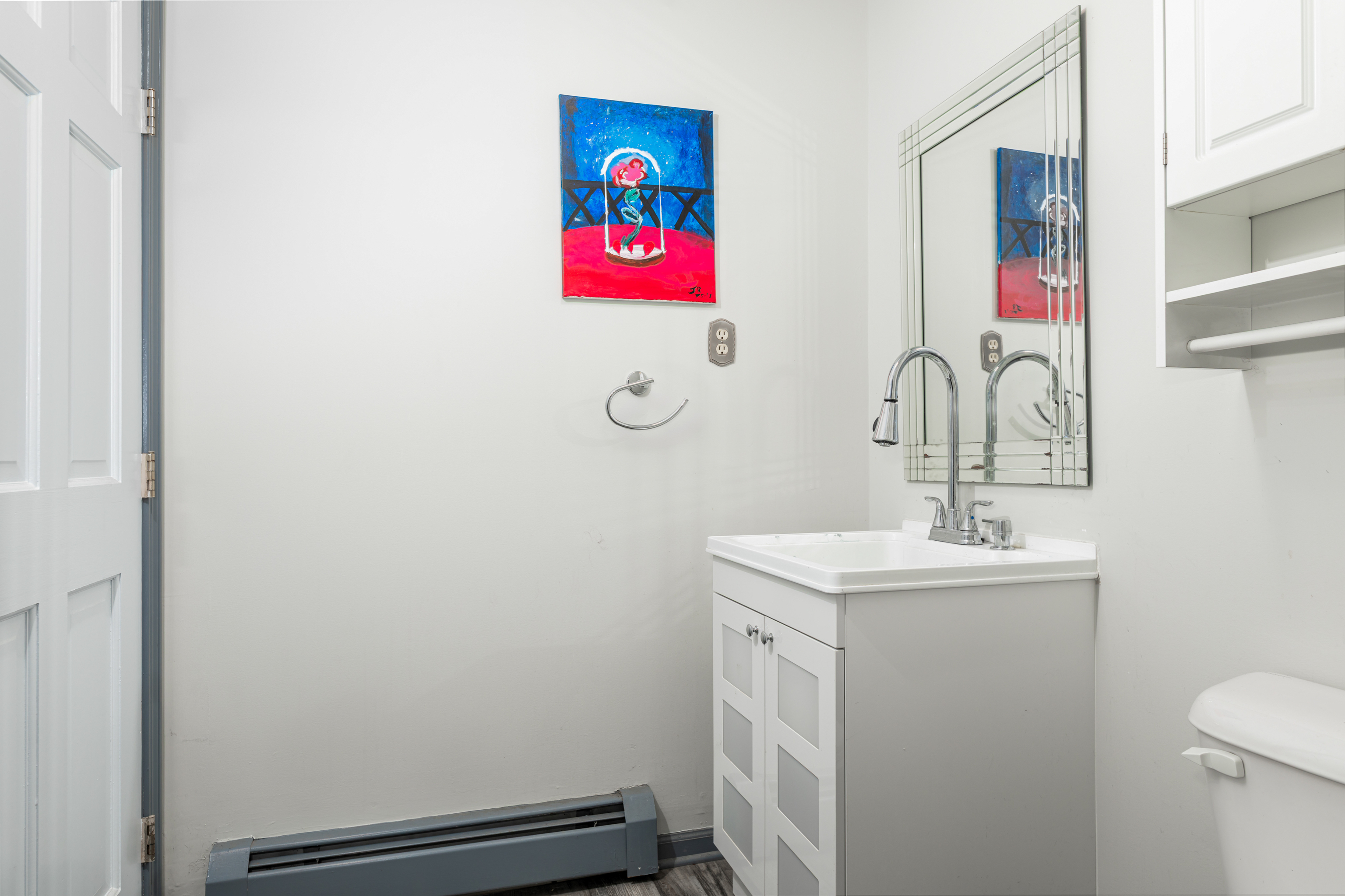 224 Roses Mill Road Milford, CT 06460 - Photo 21 of 30 a bathroom with a sink and mirror