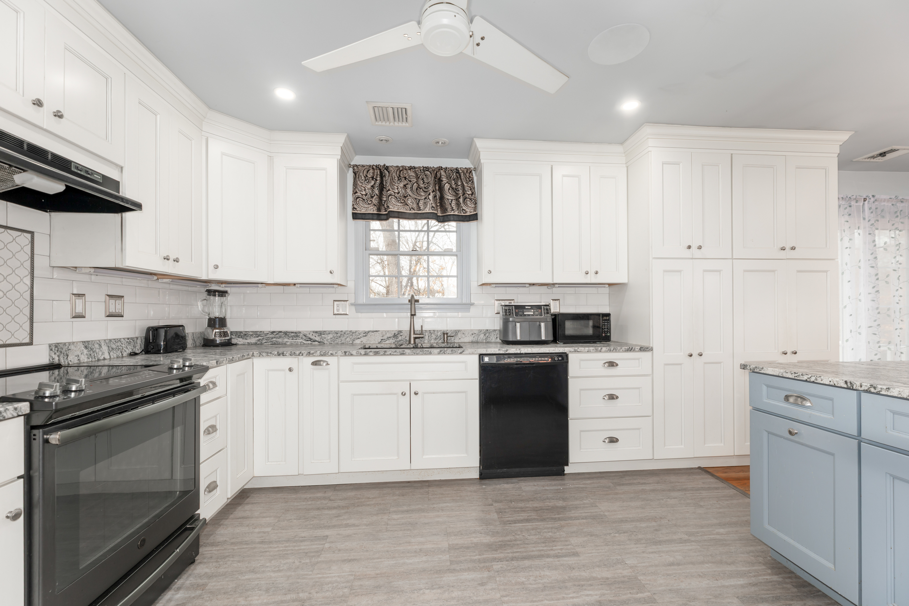 224 Roses Mill Road Milford, CT 06460 - Photo 4 of 30 a kitchen with granite countertop a sink stainless steel appliances and cabinets