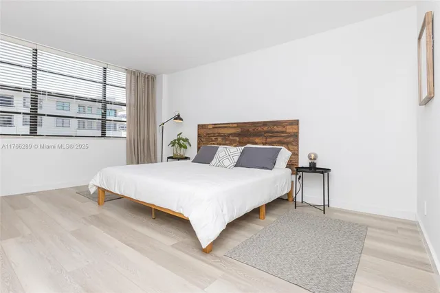 a bedroom with a bed and a table