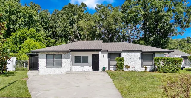 a house with trees in the background