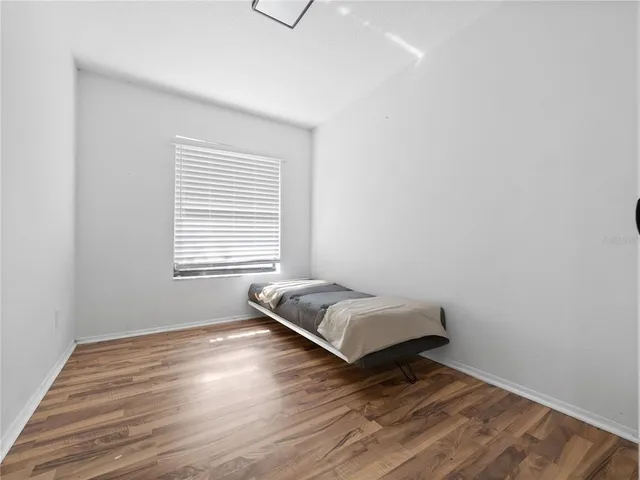 a room with a bed and a window