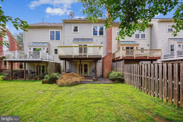 a front view of a house with porch and garden