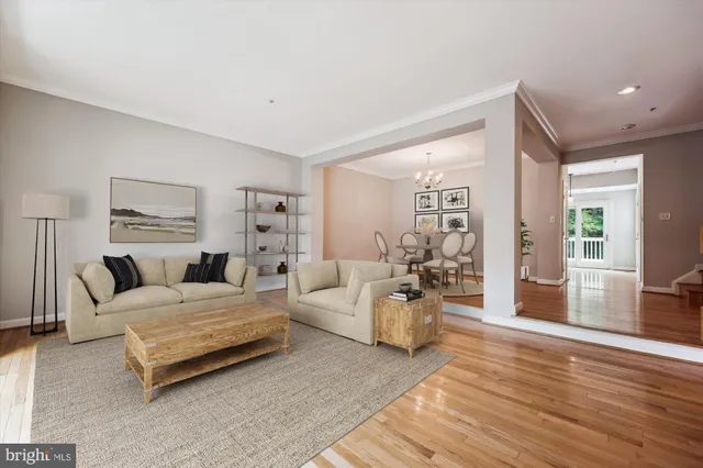 a spacious bedroom with a bed a couch and large windows