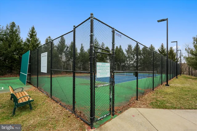 a front view of a house with a yard table and chairs