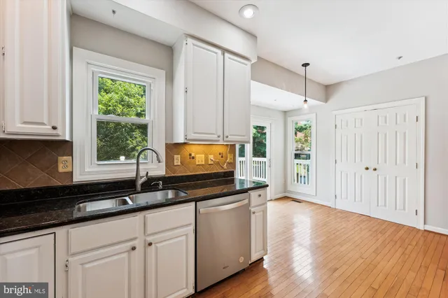 a kitchen with sink cabinets and window