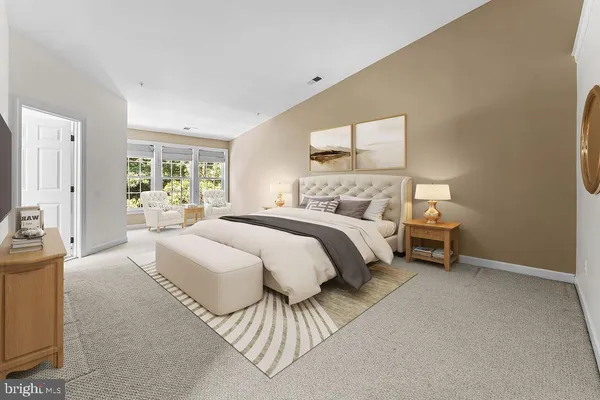 a bedroom with a bed and a table