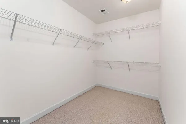a view of a room with racks on the wall