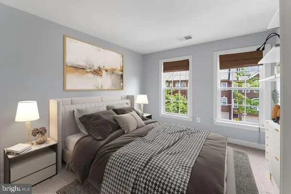 a bedroom with bed and a window