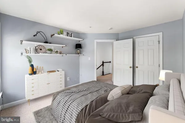 a bedroom with furniture and a couch