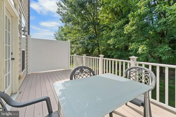 a view from deck having patio