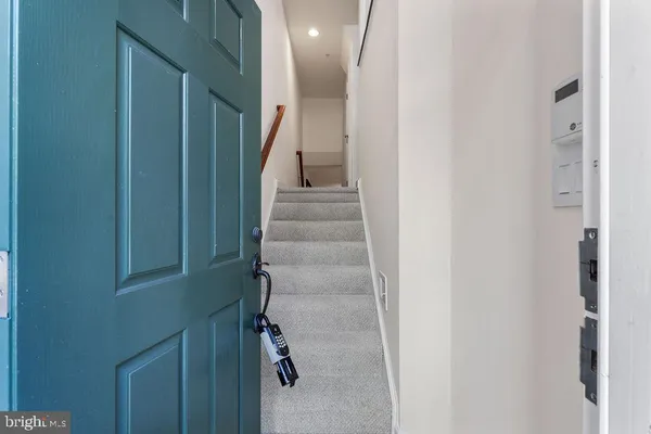 a view of staircase with white walls