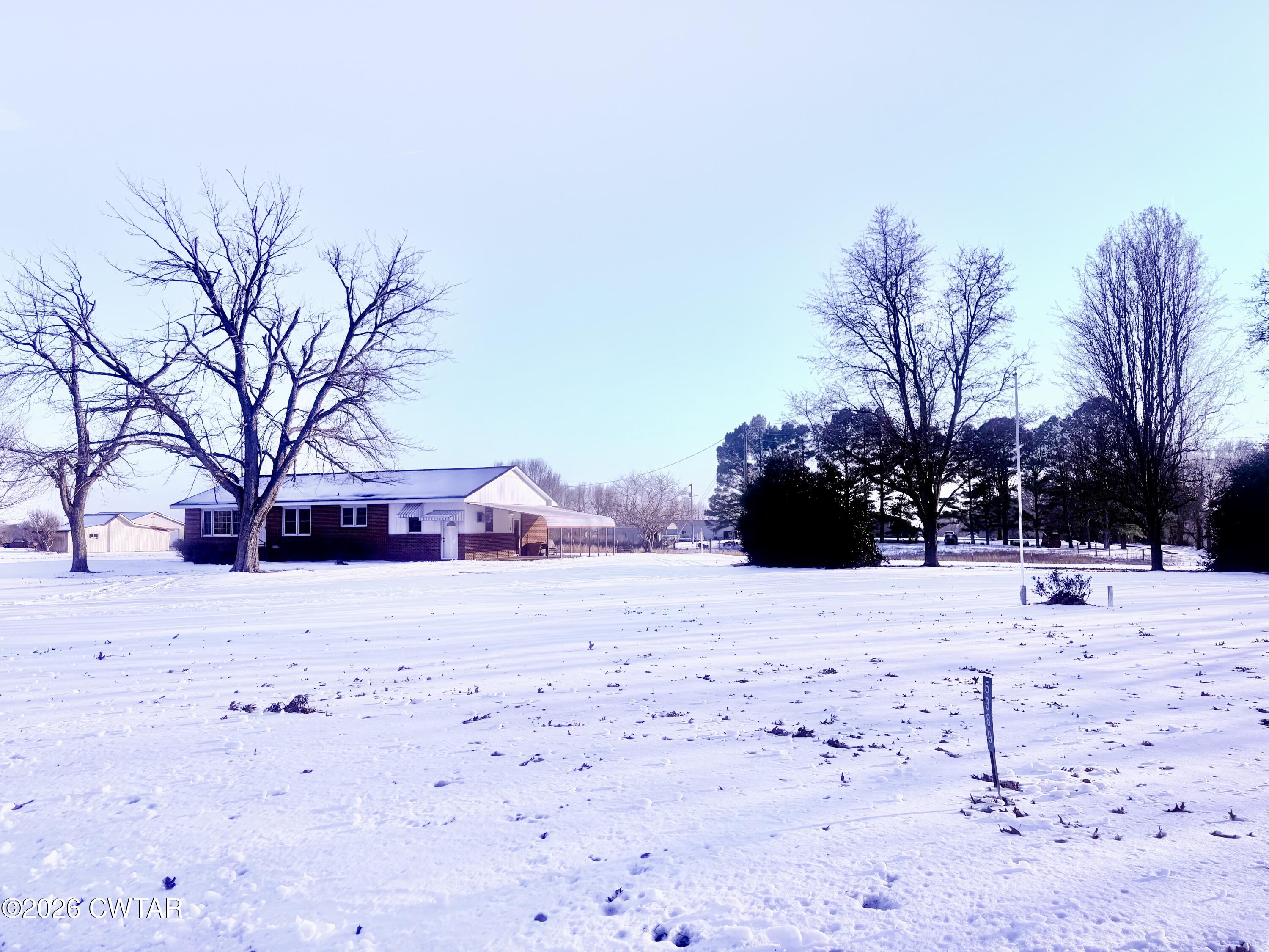 a view of a backyard of snow