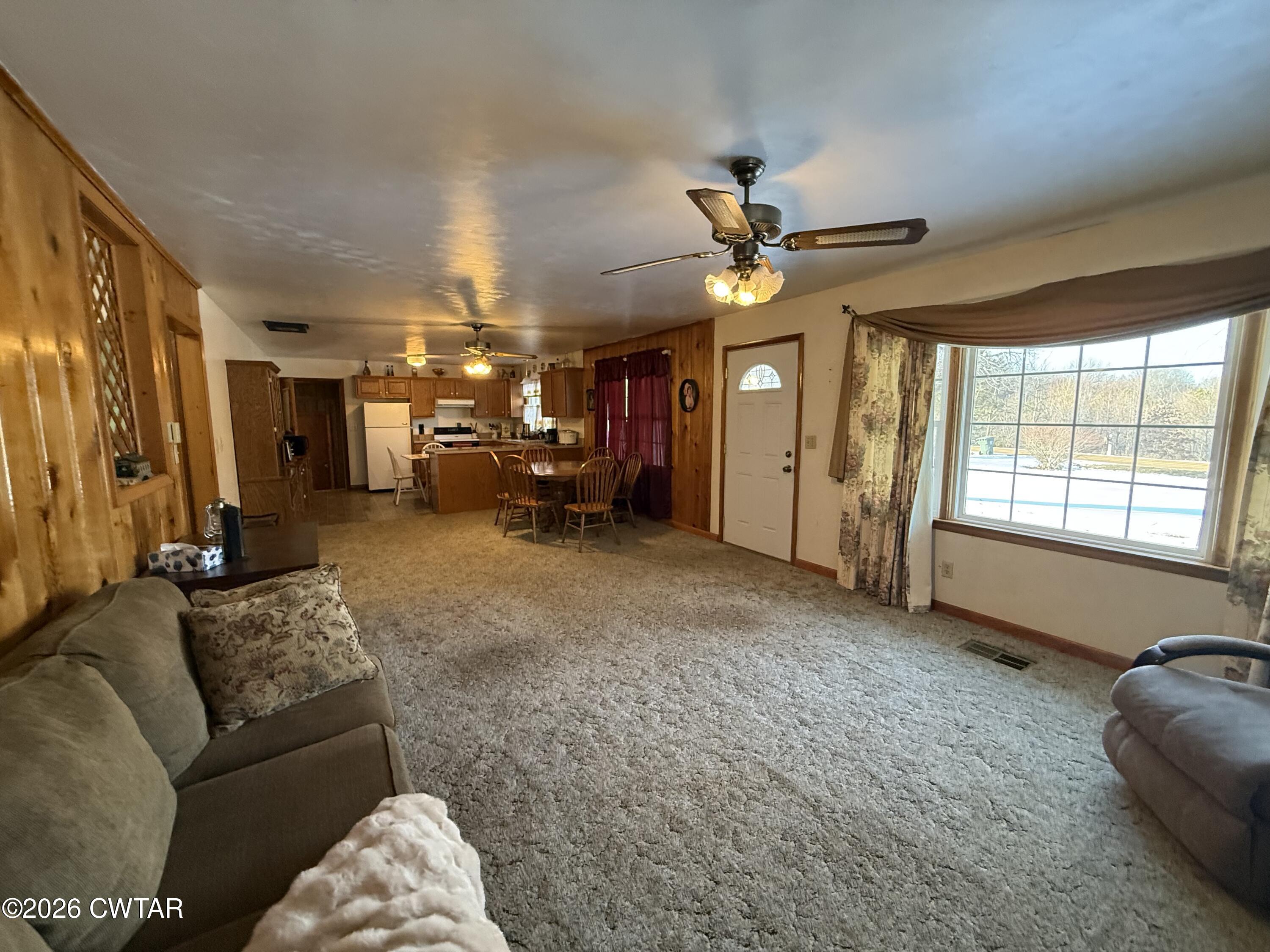 5389 Rives Mt Pelia Road Rives, TN 38253 - Photo 12 of 19 a living room with furniture and a chandelier