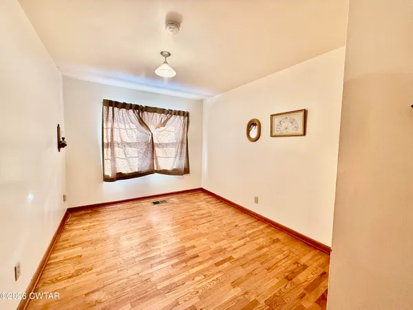 a view of an empty room and window