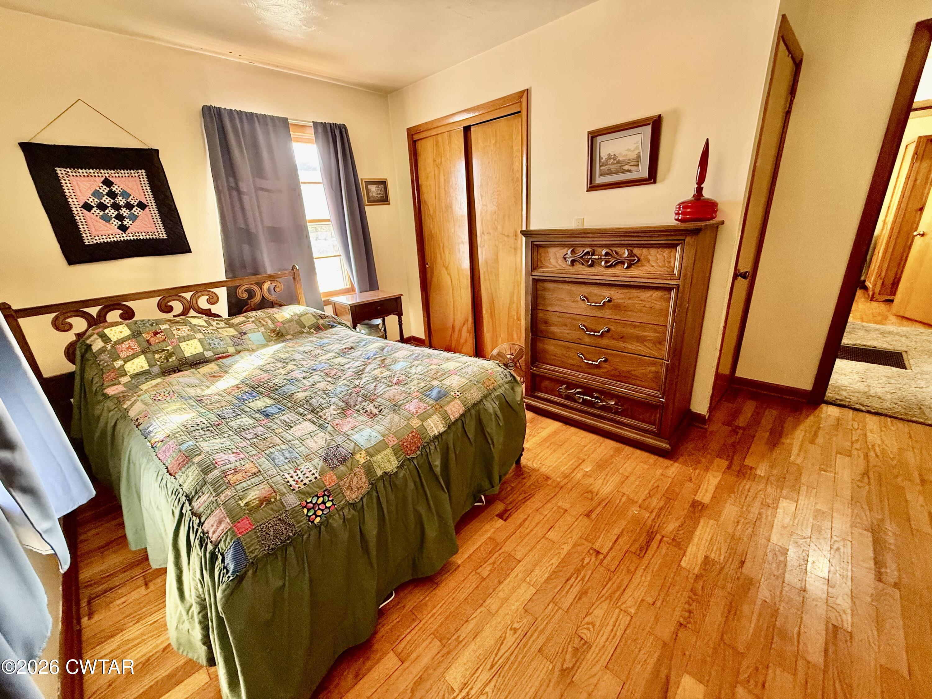 5389 Rives Mt Pelia Road Rives, TN 38253 - Photo 19 of 19 a bedroom with a bed and a flat tv screen on dresser