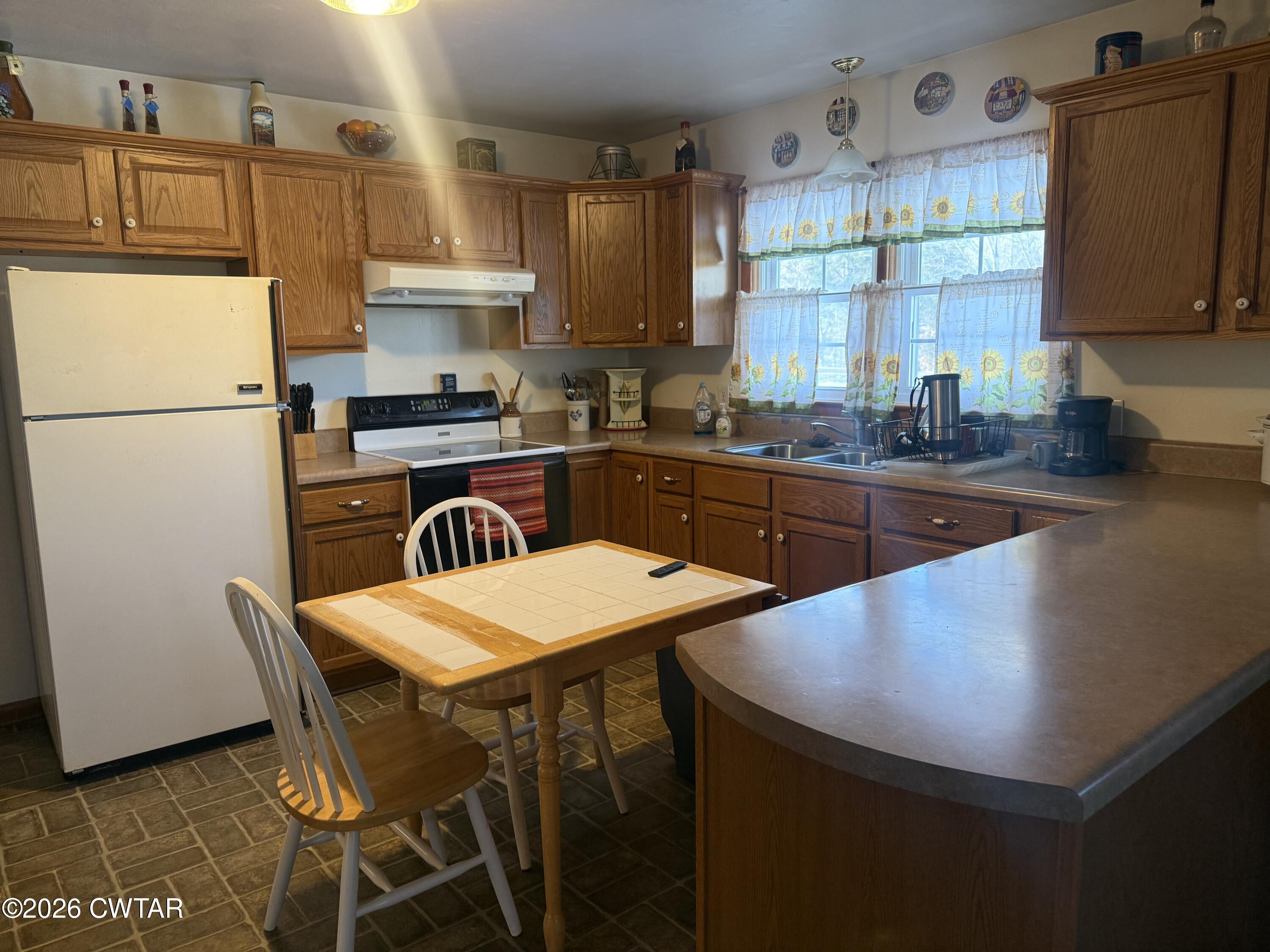 5389 Rives Mt Pelia Road Rives, TN 38253 - Photo 6 of 19 a kitchen with stainless steel appliances granite countertop a sink a stove a refrigerator and a refrigerator