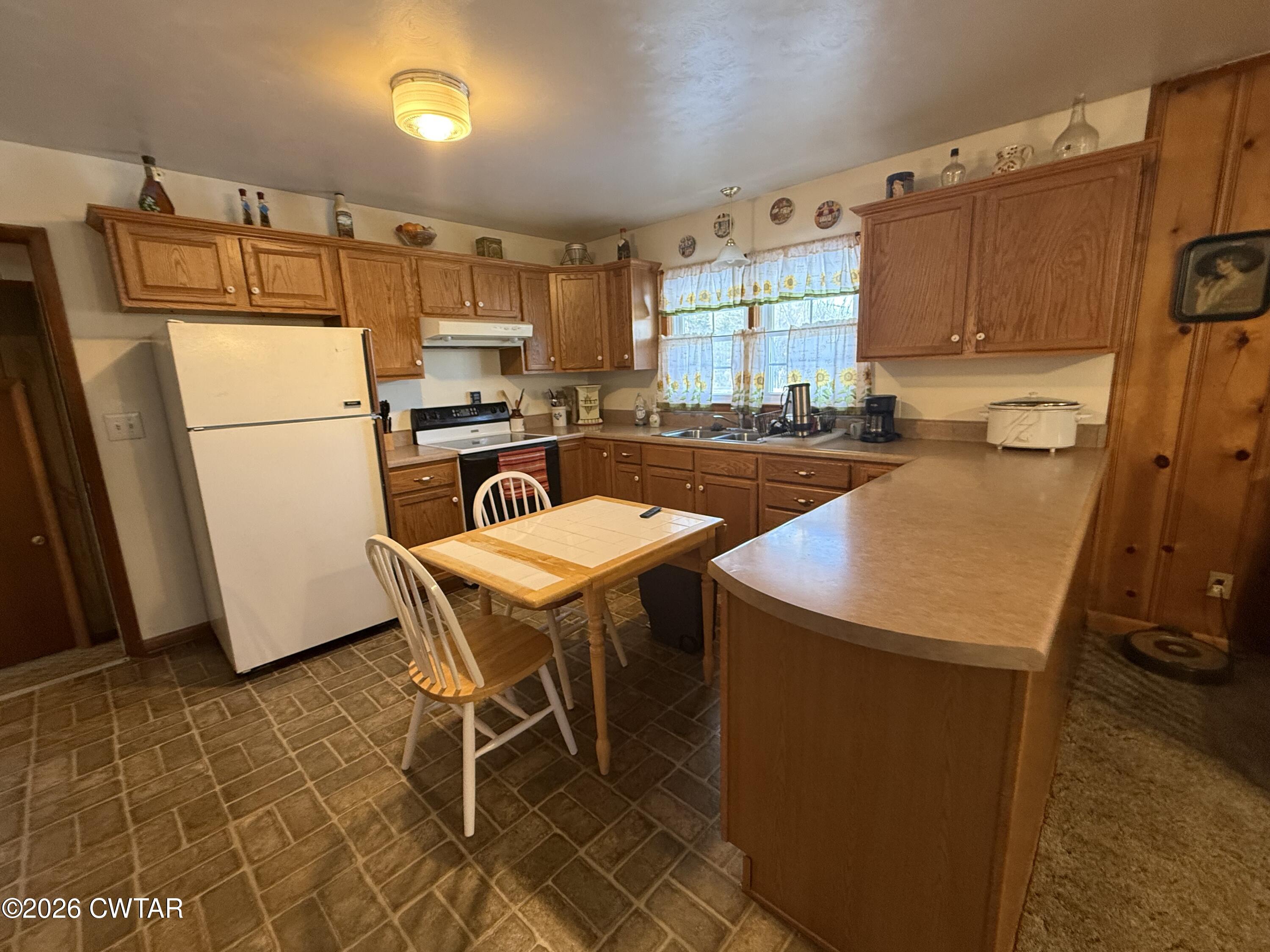 5389 Rives Mt Pelia Road Rives, TN 38253 - Photo 9 of 19 a kitchen with a refrigerator a stove a sink and dishwasher