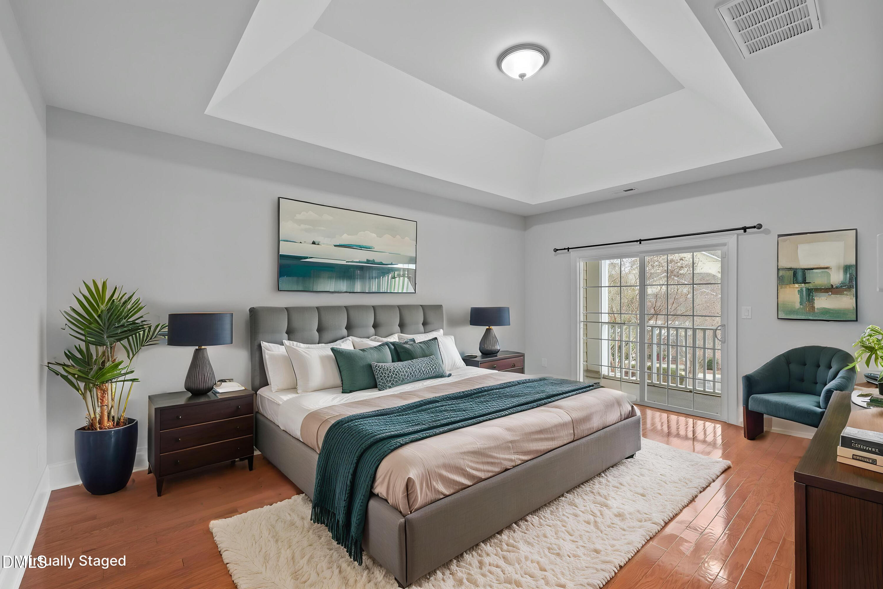 9211 Calabria Drive, Unit 205 Raleigh, NC 27617 - Photo 28 of 55 a bedroom with a bed and a couch