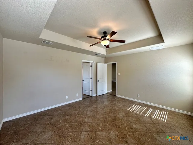 a bathroom with a bathtub a sink and a mirror