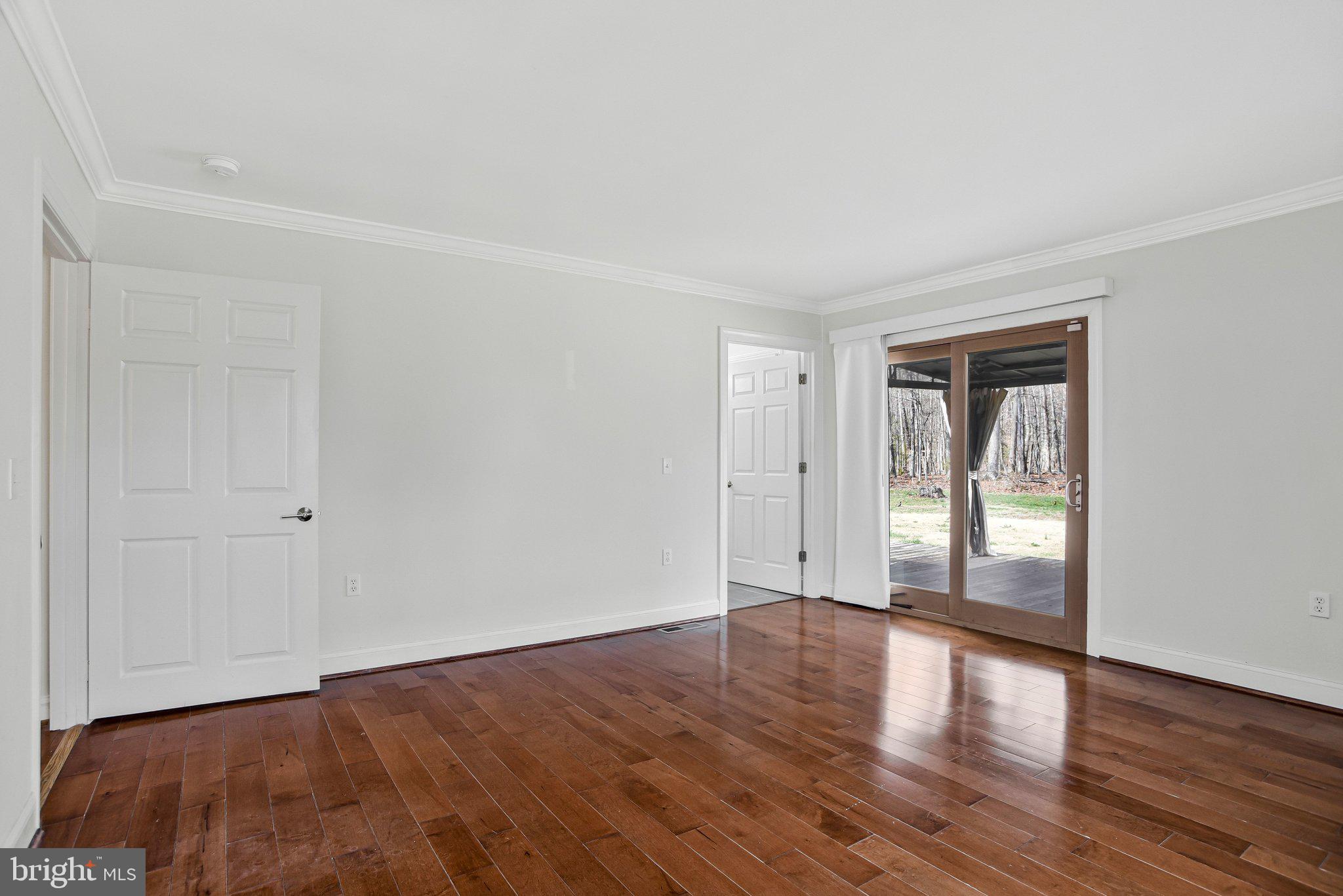223 Manning Road East Accokeek, MD 20607 - Photo 23 of 39 Sliding door leads to back yard deck