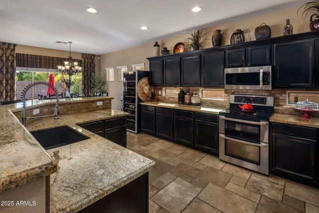 a bedroom with a bed and a flat tv screen on dresser