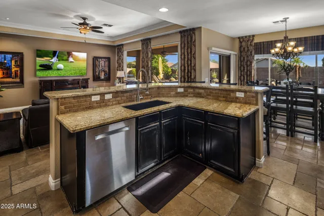 a spacious bathroom with a granite countertop sink a mirror and a shower