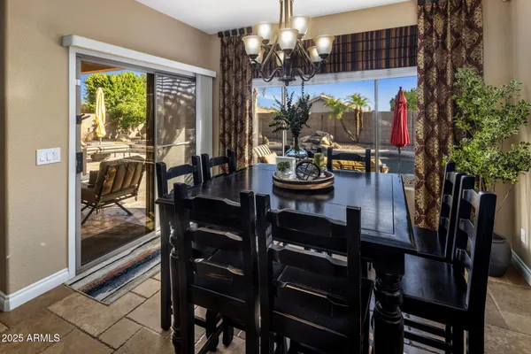 a kitchen with stainless steel appliances granite countertop a sink and a stove