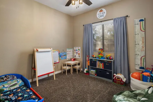 a view of a house with pool and sitting area