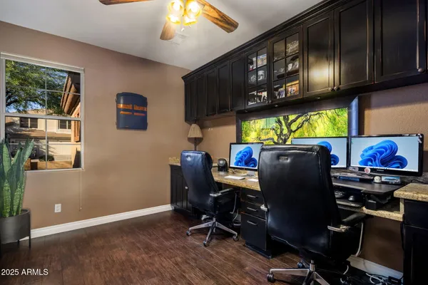 a view of a house with pool and sitting area