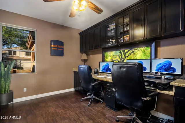 a view of a house with pool and sitting area
