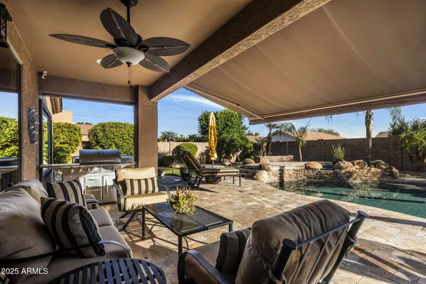 a view of a swimming pool with seating space