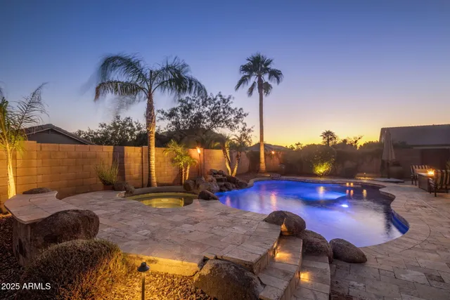 a view of a lake with couches chairs and a table