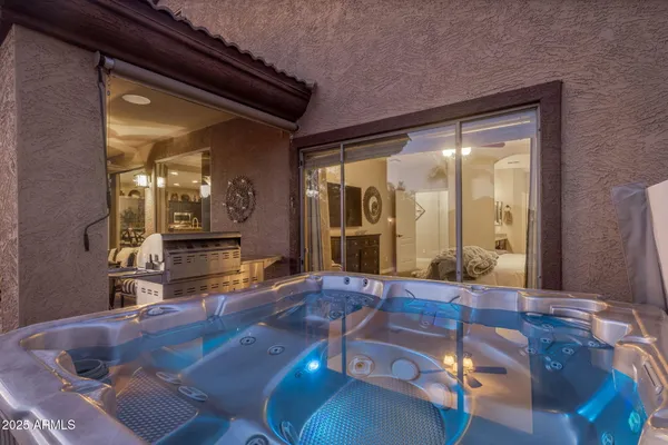 a view of a house with swimming pool and sitting area