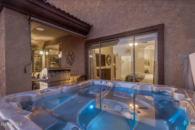 a view of a house with swimming pool and sitting area