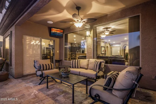 a view of a house with swimming pool and sitting area