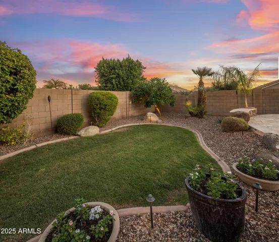 a house with swimming pool and lake view