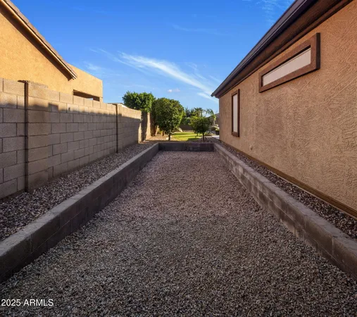 a view of a swimming pool with a lounge chair