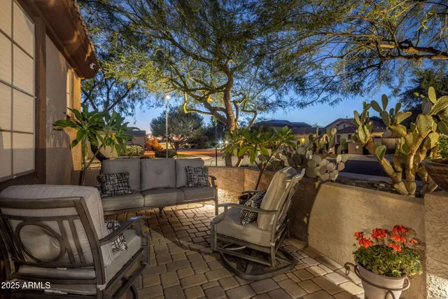 a living room with lots of furniture and a large window
