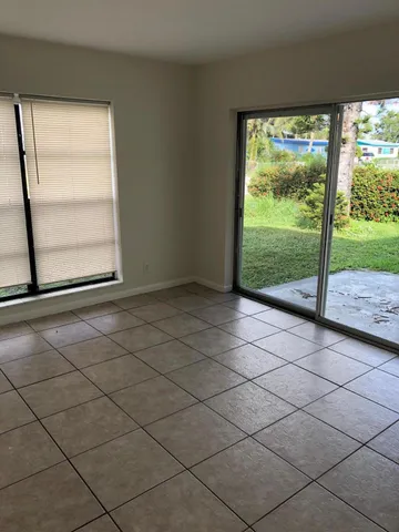 a view of a room with a large window