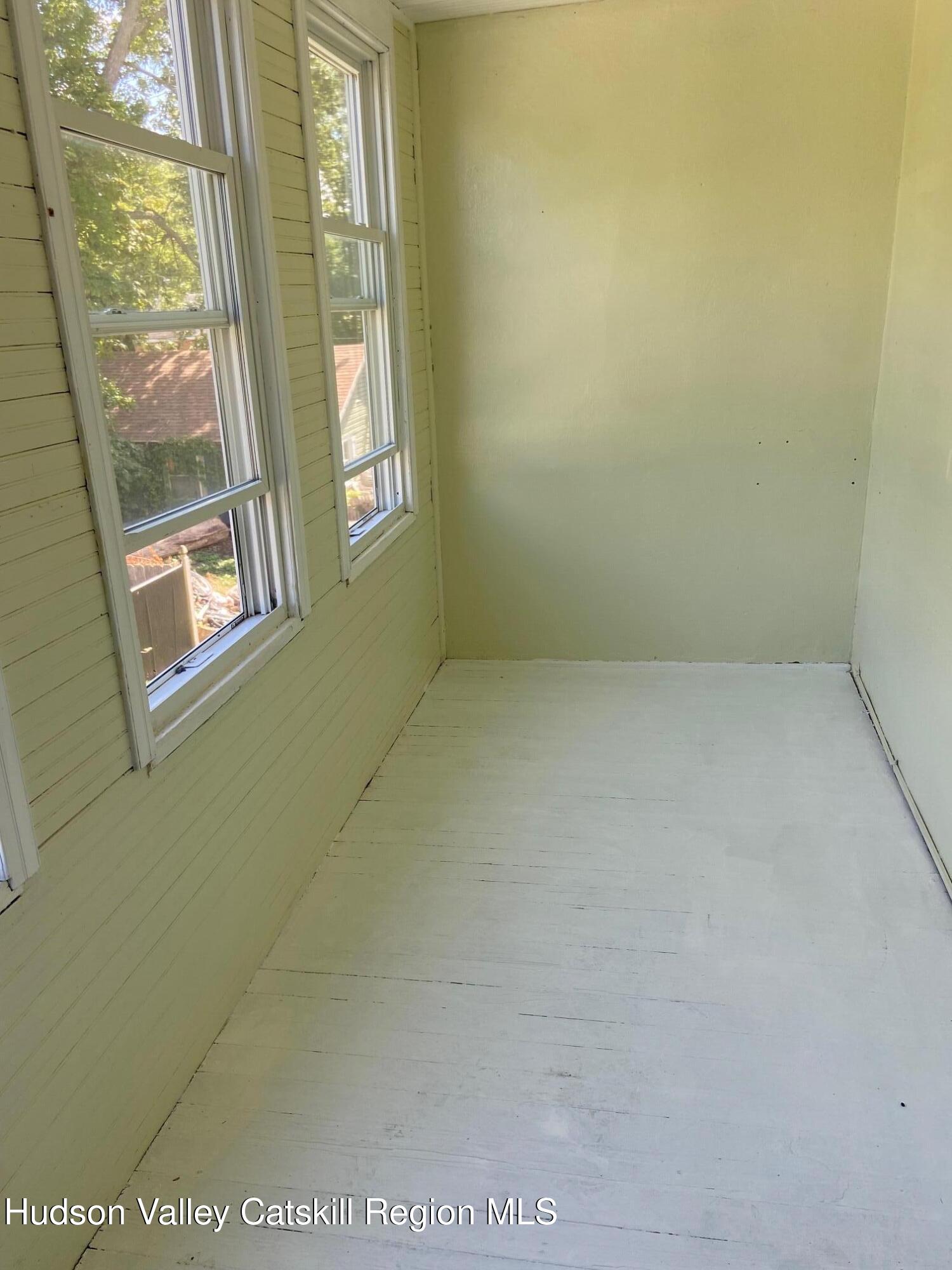 214 Robinson Street, Unit 2 Hudson, NY 12534 - Photo 11 of 13 a view of an empty room with a window