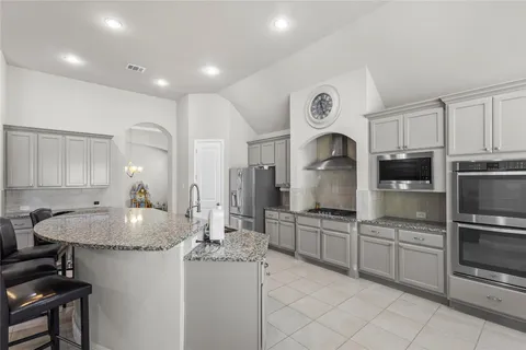 a bedroom with a bed and a night stand