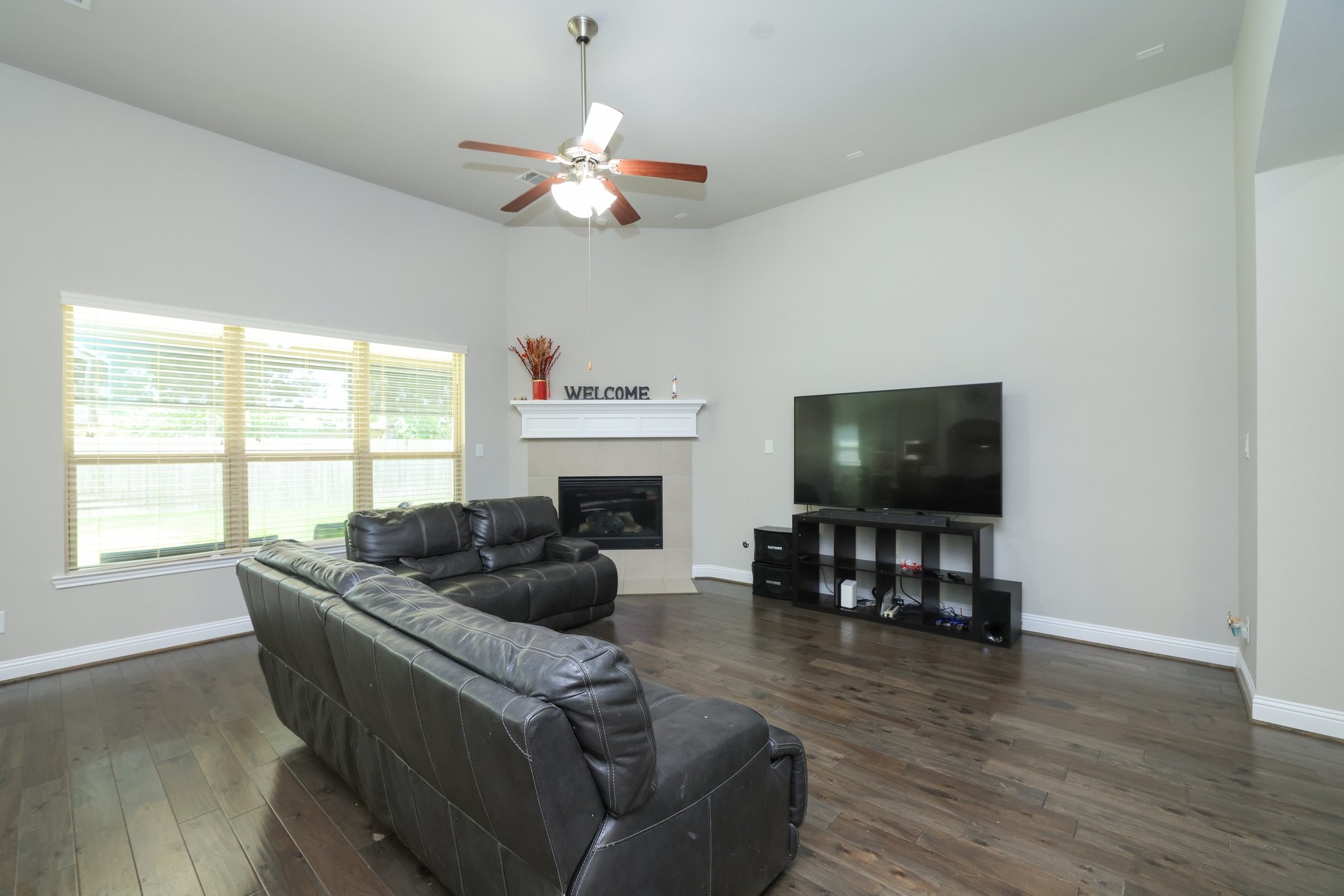 9935 Kirkstone Terrace Drive Spring, TX 77379 - Photo 23 of 49 Open concept family room with triple windows to backyard