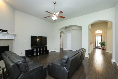 a view of house with backyard and outdoor seating