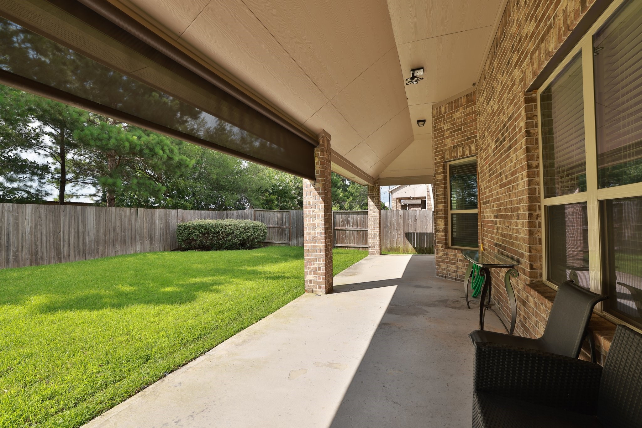 9935 Kirkstone Terrace Drive Spring, TX 77379 - Photo 38 of 49 Woowww... this covered patio with sun shade measures 37x16. Ready for an outdoor kitchen