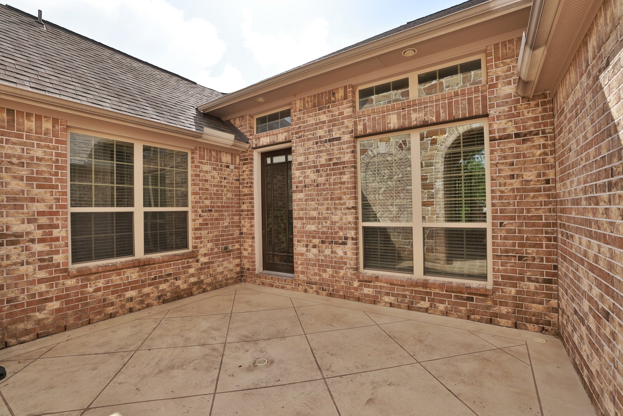 9935 Kirkstone Terrace Drive Spring, TX 77379 - Photo 6 of 49 Tiled courtyard and glass door to entrance to home