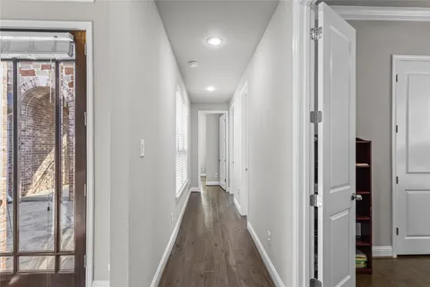 a kitchen with granite countertop a table and chairs in it