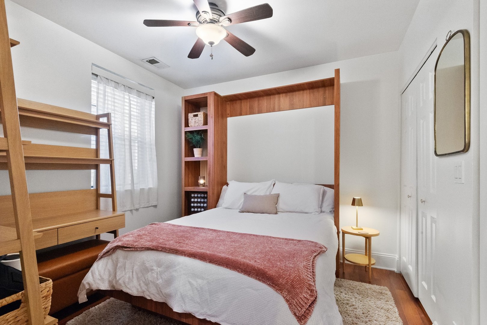 2314 Sherman Avenue, Unit G Evanston, IL 60201 - Photo 11 of 15 a bedroom with a bed and a chandelier