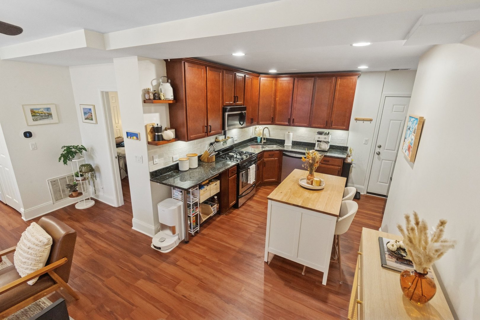 2314 Sherman Avenue, Unit G Evanston, IL 60201 - Photo 8 of 15 a kitchen with a refrigerator a sink and wooden floor