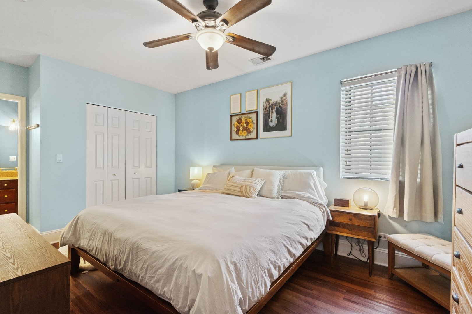 2314 Sherman Avenue, Unit G Evanston, IL 60201 - Photo 9 of 15 a bedroom with a large bed and a chandelier
