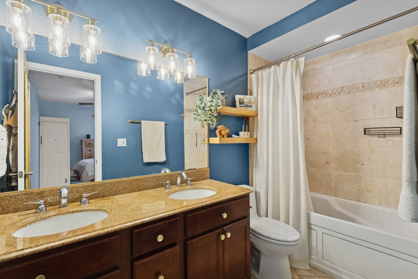 2314 Sherman Avenue, Unit G Evanston, IL 60201 - Photo 10 of 15 a bathroom with a granite countertop sink toilet and shower